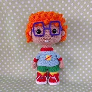 Crochet Stuffed Toy with Orange Hair and Blue Shirt